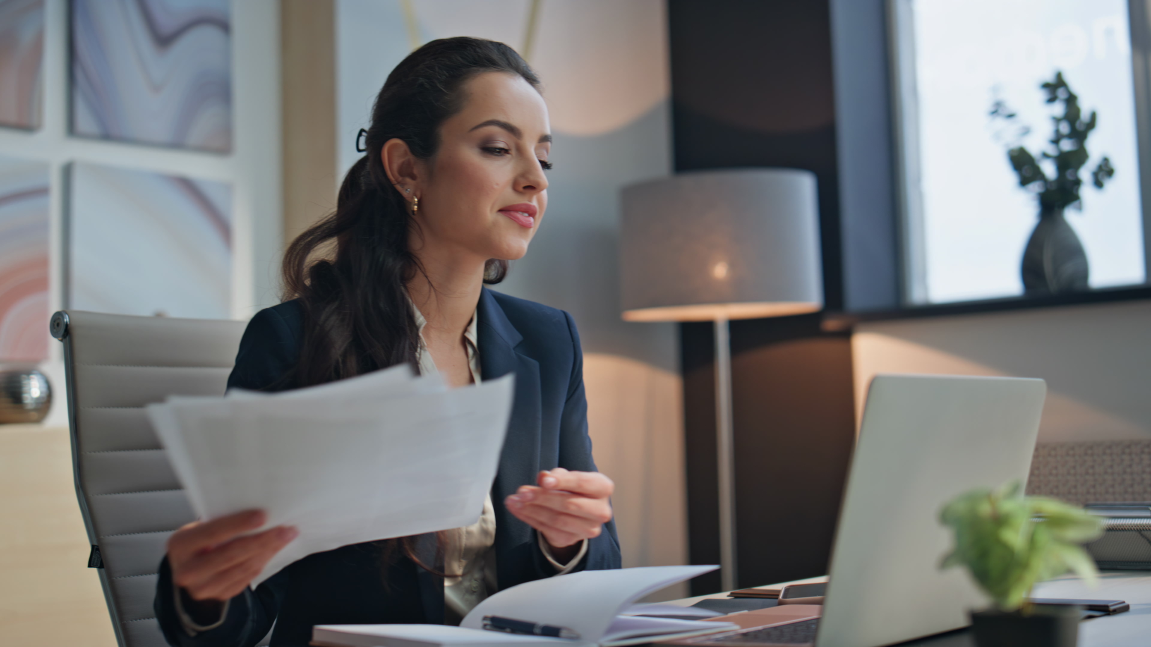 Two business women in an office with packages