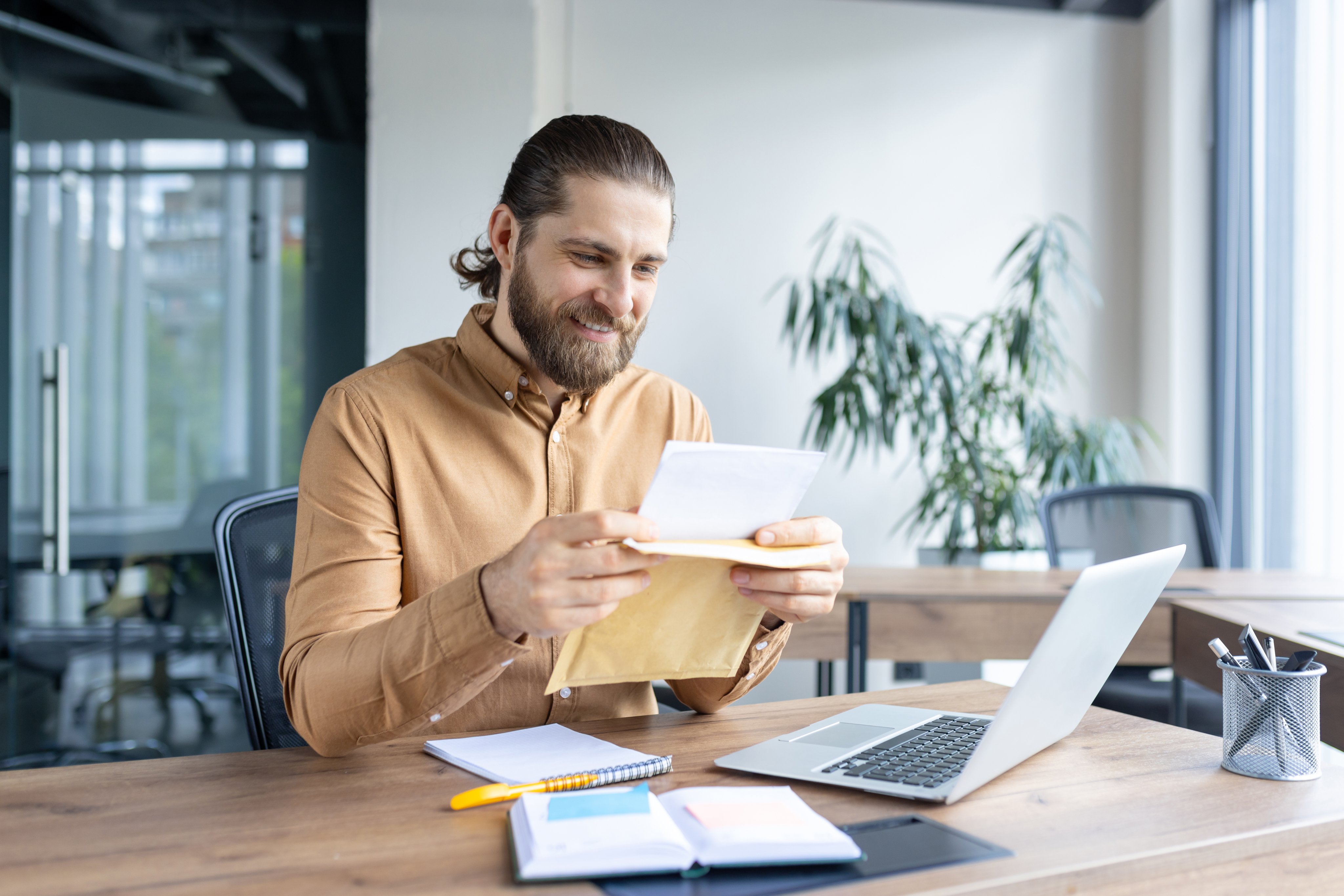 Two business women in an office with packages
