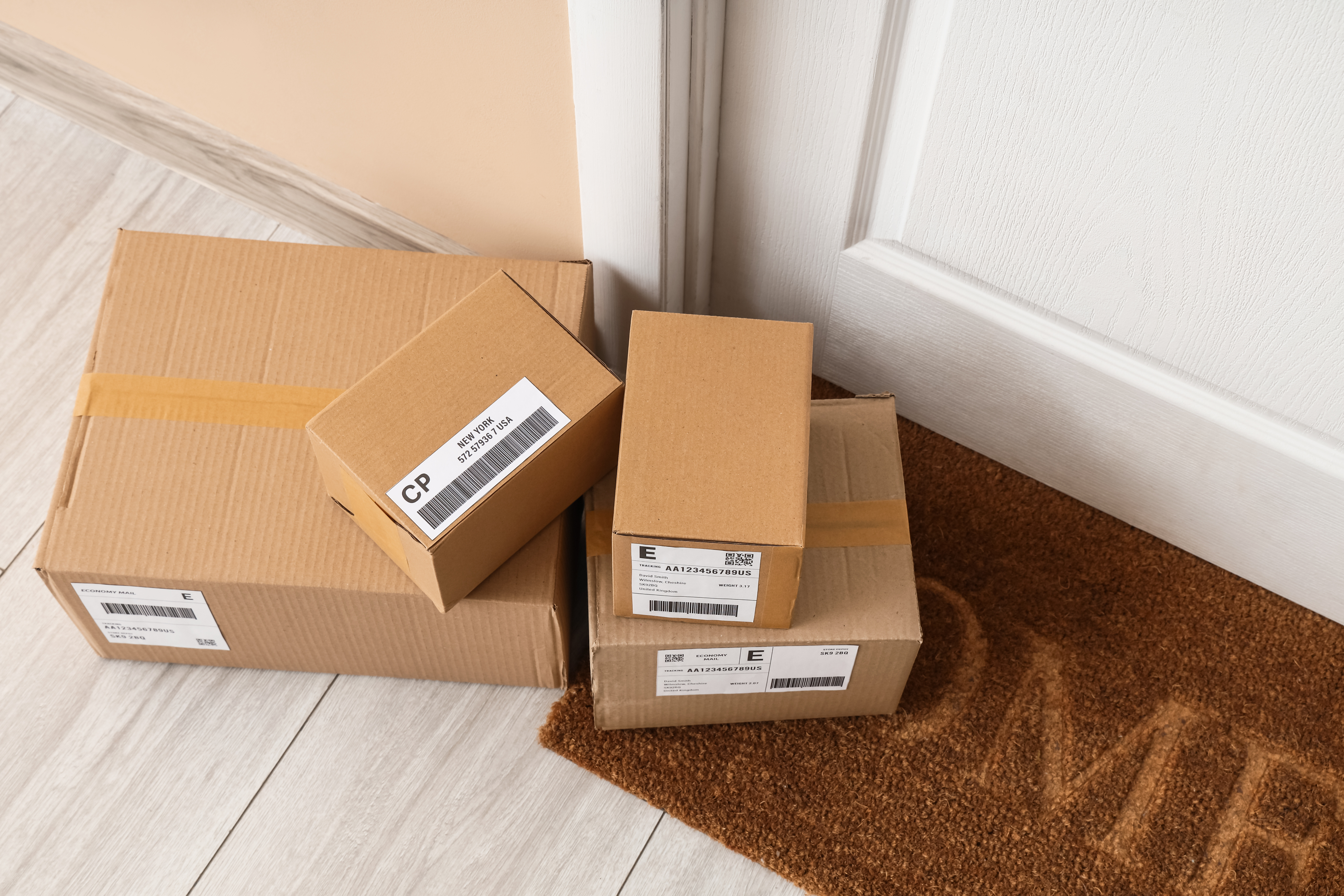 Woman on phone with packages at desk