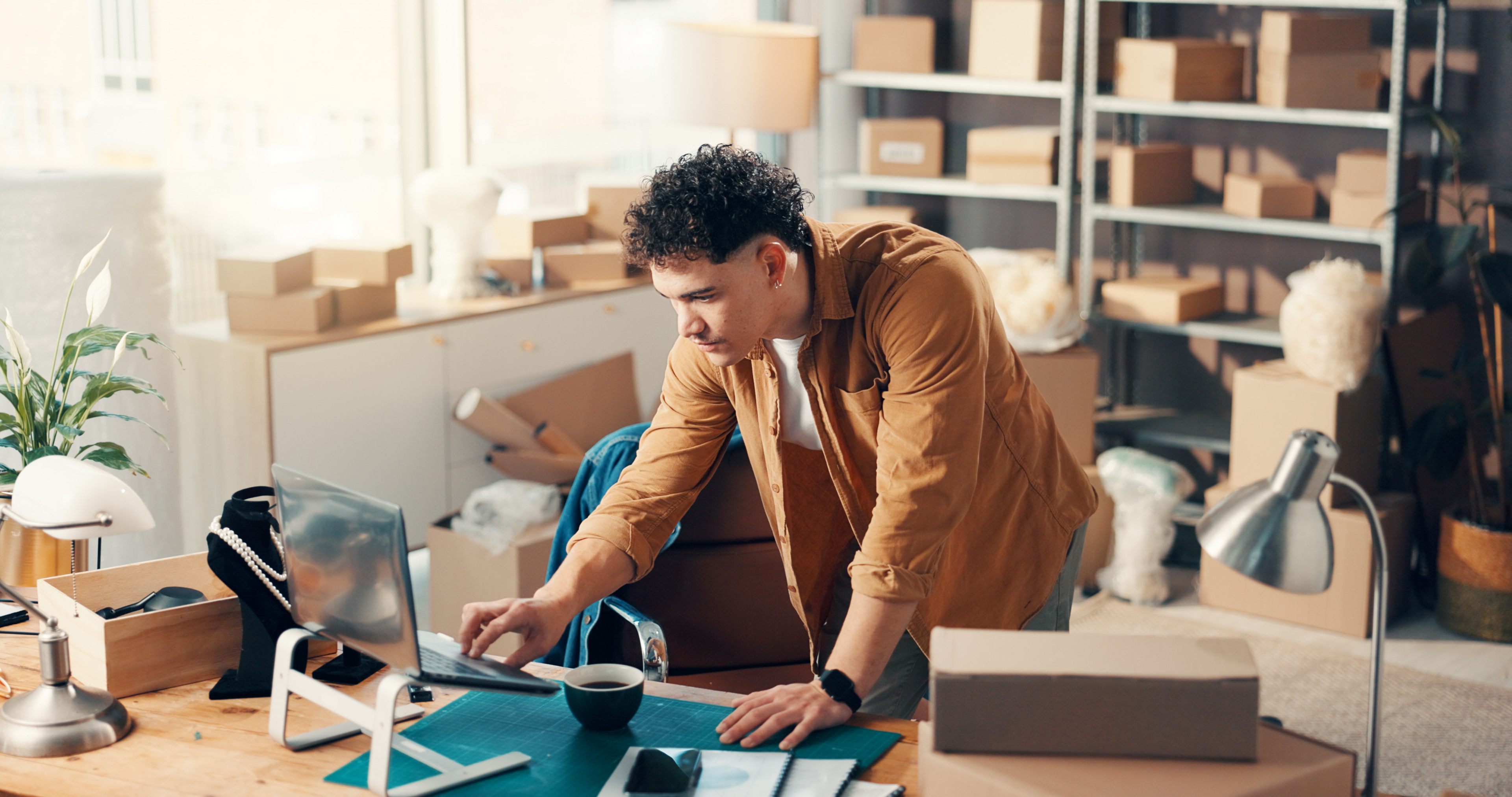 Woman on phone with packages at desk