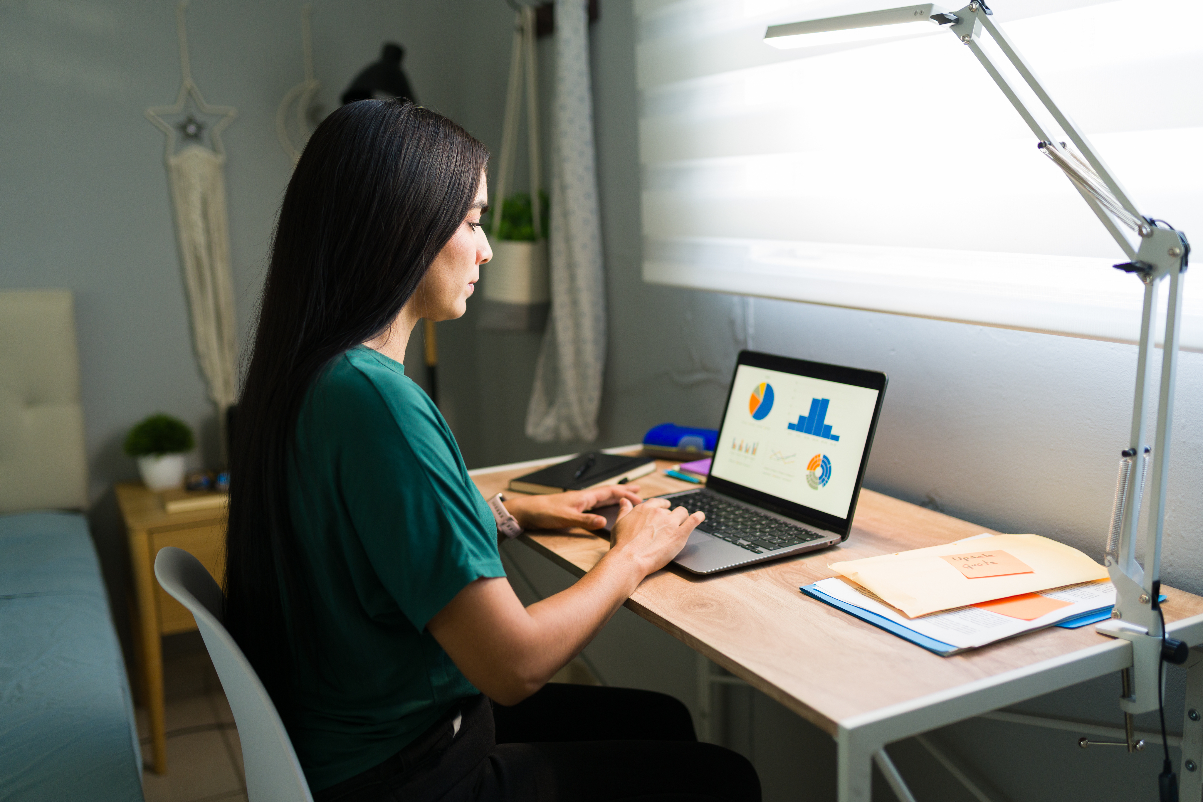 Woman on phone with packages at desk