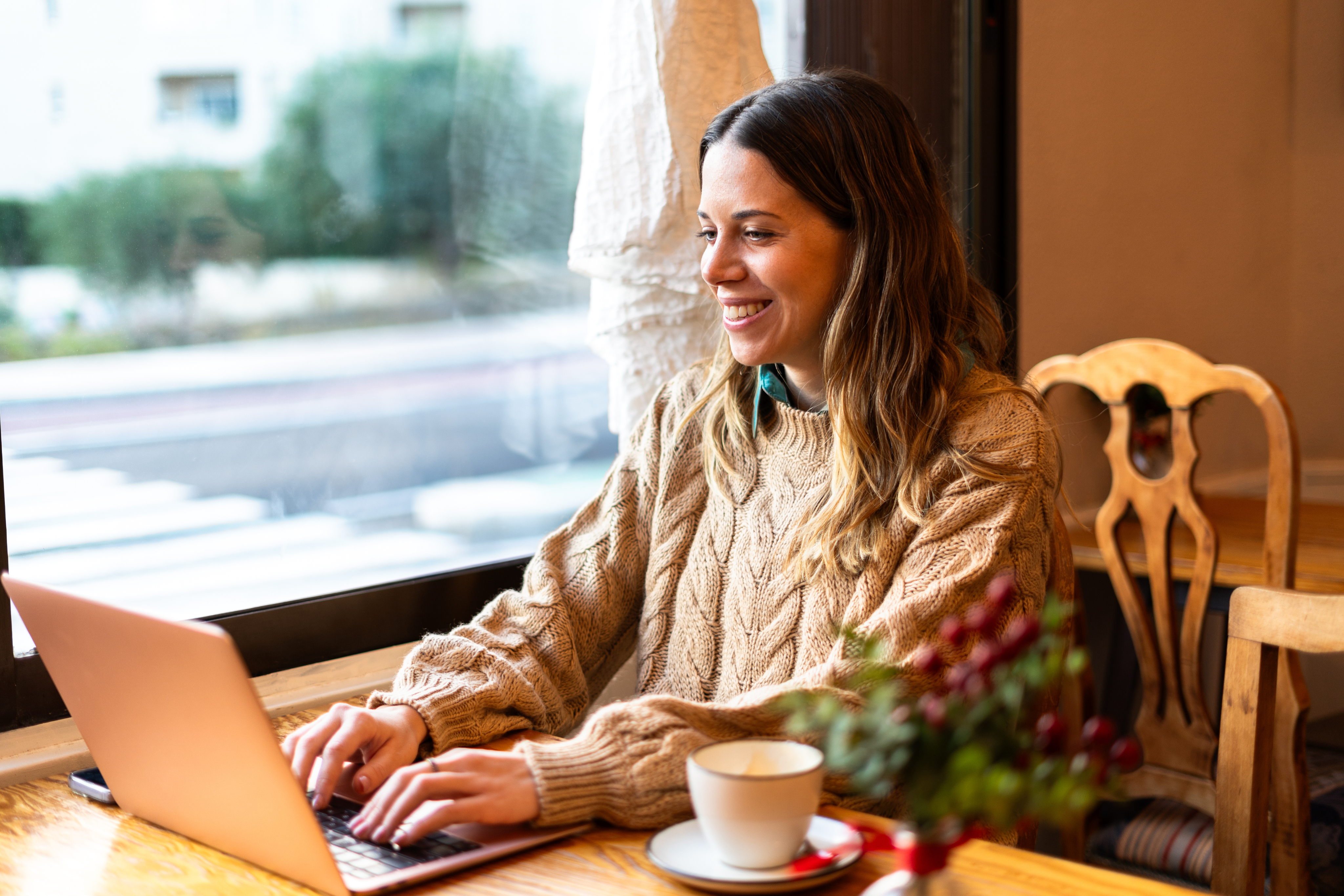 Woman on phone with packages at desk