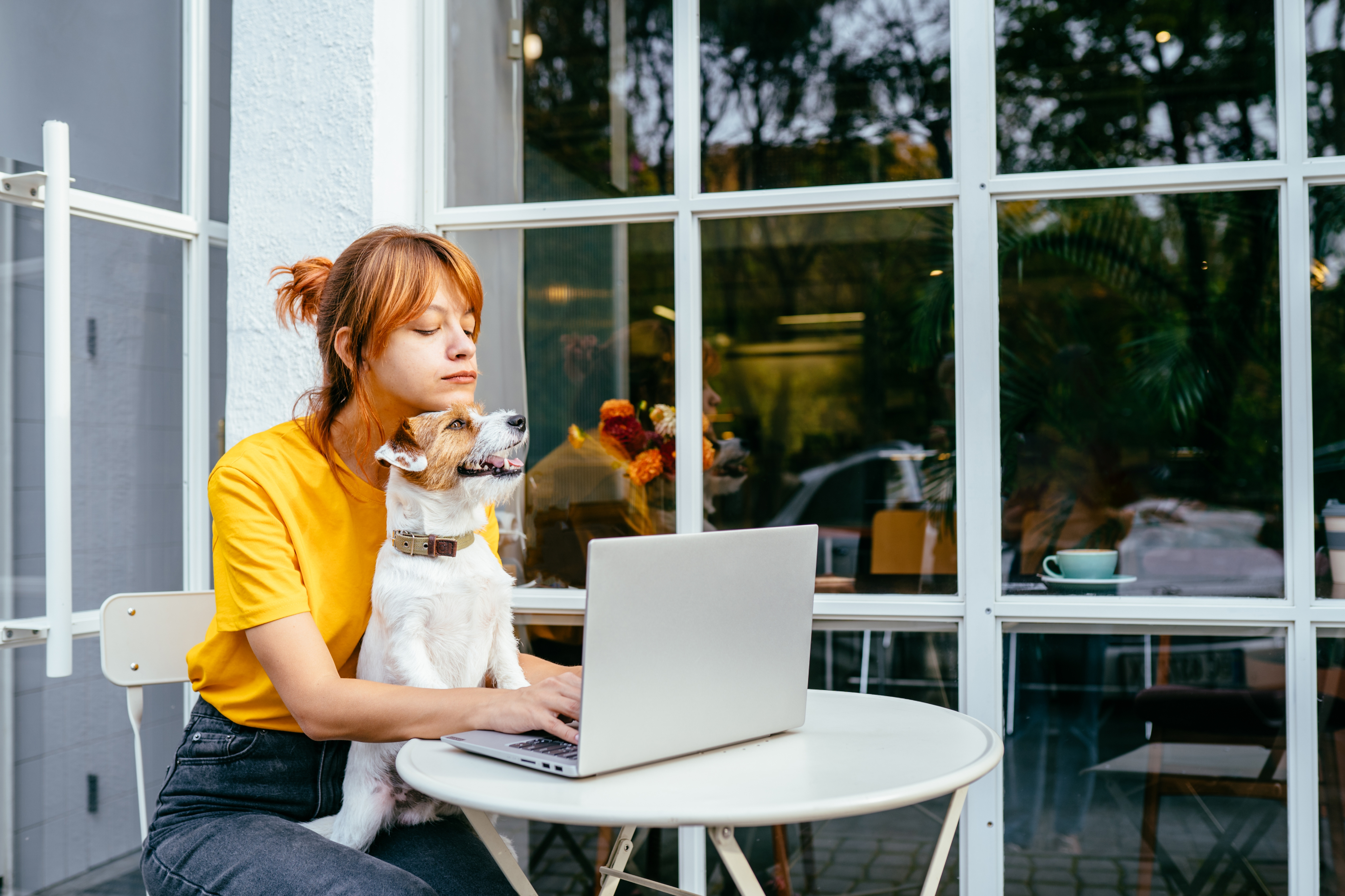 Woman on phone with packages at desk
